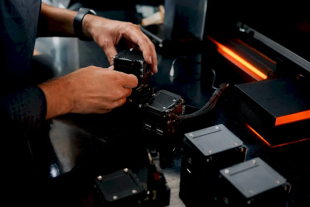 Hands assembling AI automation components