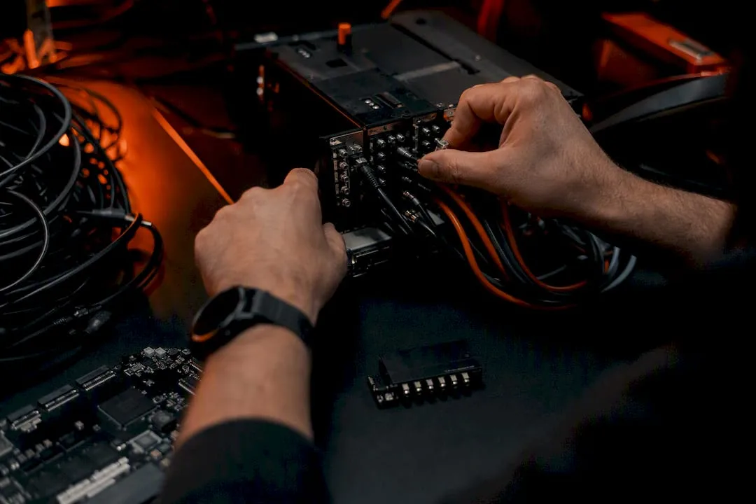 Hands assembling hardware parts symbolizing hybrid compression
